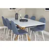 A dining table with chairs in a room setting. Produktbild-Vorschau