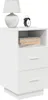 A white bedside table with two drawers and an open shelf, featuring a lamp and an alarm clock on top. Náhled obrázku produktu