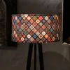 A close-up shot of a floor lamp with a patterned lampshade. Anteprima dell’immagine prodotto