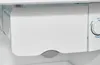 Close-up view of an ice maker compartment and temperature control dial inside a refrigerator. Produktbild-Vorschau