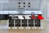 A row of bar stools in front of a kitchen counter. Produktbild-Vorschau