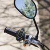 A close-up shot of a motorcycle handlebar with a Bluetooth controller attached. Produktbild-Vorschau