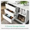 A white storage cabinet with three drawers open, showing items inside, and a shelf with books and boxes. Voir les images du produit