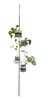 A plant stand with multiple shelves holding potted plants, isolated on a white background.