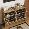 A shoe cabinet filled with shoes, placed in a hallway or entryway. Anteprima dell’immagine prodotto