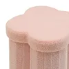 A close-up view of a pink, textured storage stool with a flower-like top. Podgląd zdjęcia produktu