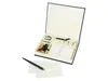 A calligraphy set is displayed open in its box, with a pen and paper in the foreground. Produktbild-Vorschau