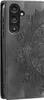A close-up view of a black flip phone case with a mandala design embossed on it. Produktbild-Vorschau