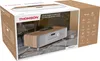 The image shows the retail packaging of a Thomson micro system, with the product visible inside. Voir les images du produit