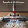 A close-up of a vacuum cleaner head with LED lights illuminating the carpet and debris. Produktbild-Vorschau