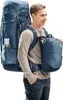 A man wearing a backpack and a smaller pack attached to the front. Podgląd zdjęcia produktu