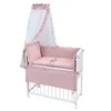 A baby crib with bedding and a canopy, presented on a white background. Produktbild-Vorschau