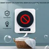 A mini clothes dryer is shown mounted on a wall, with a basket of clothes below it. Produktbild-Vorschau
