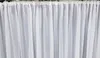 A close-up view of white sheer curtains hanging from a rod. Produktbild-Vorschau