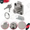 A collage of images showing a furniture lock with keys, a mounting ring, and a bracket, set against a blueprint background of a house. Anteprima dell’immagine prodotto