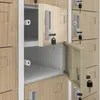 A close-up view of several open and closed lockers with keys in the locks. Náhled obrázku produktu