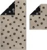 Two towels with paw print pattern, one larger and one smaller, displayed side-by-side. Produktbild-Vorschau