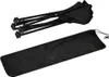 A folded black camping table and its carrying bag are shown against a white background. Produktbild-Vorschau