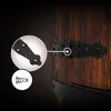 A close-up view of a black metal hinge attached to a wooden barrel. Podgląd zdjęcia produktu