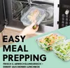A hand places a glass container with salmon and vegetables into a microwave, while other containers with zucchini noodles and shrimp are shown in the foreground. Voir les images du produit
