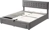 A grey upholstered bed frame with a tufted headboard and a slatted mattress support system is shown against a white background. The bed frame has built-in drawers visible at the foot of the bed. Produktbild-Vorschau