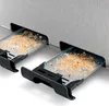 Close-up of the crumb tray and slots of a toaster. Anteprima dell’immagine prodotto