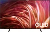 A Samsung OLED television is displayed on a black stand against a dark background. Produktbild-Vorschau