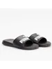 A pair of black Puma slides on a white background. Anteprima dell’immagine prodotto