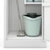 A cleaning bucket and mop are stored inside a white cabinet. Náhled obrázku produktu