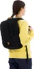 A person wearing a yellow sweater and dark blue pants is shown from the back, wearing a black backpack. Anteprima dell’immagine prodotto