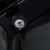 A close-up view of a screw and washer assembly on a black surface, likely part of a toilet. Náhľad obrázku produktu