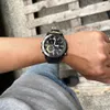 A person wearing a watch on their wrist. Produktbild-Vorschau