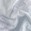 A close-up shot of draped fabric with a subtle wave and line pattern. Produktbild-Vorschau