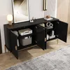 A black sideboard with gold legs is shown in a room with a rug and a framed picture. Produktbild-Vorschau