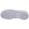 The underside of a white Nike shoe with pink accents. Produktbild-Vorschau