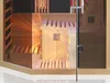 Interior view of a modern infrared sauna cabin with wooden benches and glass door. Produktbild-Vorschau