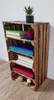 A wooden crate shelf unit with books and decorative items. Náhled obrázku produktu
