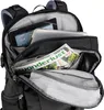 Close-up view of the inside of a black backpack, showing a tablet, a laptop, and a magazine. Produktbild-Vorschau