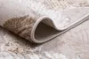A close-up view of a rug, showing the texture and edge. Anteprima dell’immagine prodotto