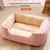A pink and beige pet nest is shown on a fluffy white rug. Produktbild-Vorschau