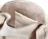 A close-up view of the interior of a bag, showing the fuzzy lining and a pocket. Náhled obrázku produktu