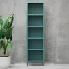 A teal metal bookshelf stands against a concrete wall, with a large potted plant to its left. Náhled obrázku produktu