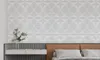 A bedroom scene with a textured wall, a modern desk, and a bed with pillows. Produktbild-Vorschau