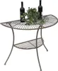 A metal half-round table with two wine bottles and a plant on top. Produktbild-Vorschau