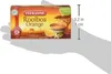 A hand holding a box of Teekanne Rooibos Orange tea. Podgląd zdjęcia produktu