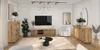 A modern living room with a TV stand, cabinets, seating, and decor. Produktbild-Vorschau