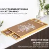 A puzzle board with puzzle pieces and drawers, set on a countertop. Produktbild-Vorschau