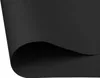 A close-up view of a black blackout roller blind, with one corner curled up to reveal the underside. Produktbild-Vorschau