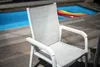 A chair is placed on a wooden deck next to a swimming pool with a colorful inflatable in it. Produktbild-Vorschau