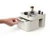 A hand is shown pulling out a drawer from a cosmetic organizer. Náhled obrázku produktu